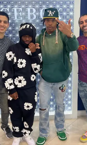 42 Dugg wearing Denim Tears pants