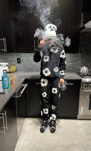BabyTron wearing Denim Tears pants