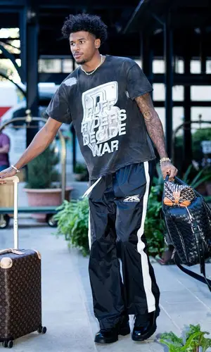 Jalen Green’s Outfit in Who Decides War T-Shirt, Louis Vuitton Bag & Goyard (2023)
