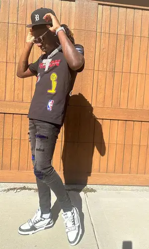 SleazyWorld Go wearing New Era cap