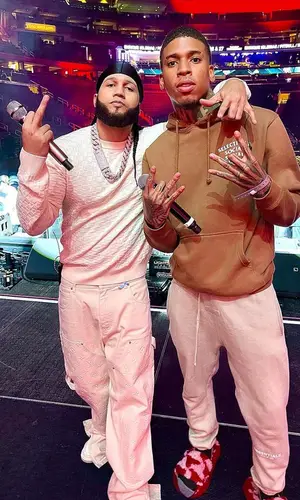 El Alfa El Jefe wearing Louis Vuitton sweater