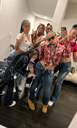 Latto wearing True Religion jeans