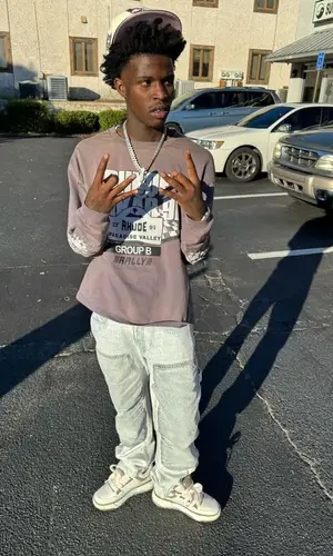 Quando Rondo wearing Rhude sweatshirt