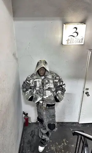 Bloody Osiris’ Outfit in Raf Simons Jacket, Nike Sneakers & ERL Belt (2023)