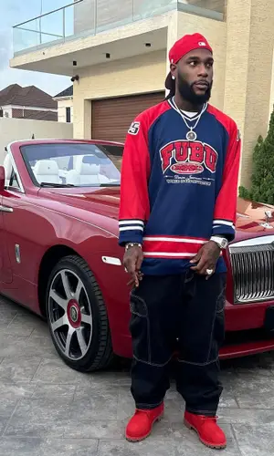 Burna Boy wearing Fubu jersey