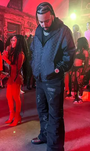 French Montana wearing Louis Vuitton jacket