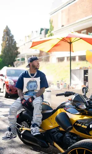 Chino Braxton wearing Who Decides War jeans