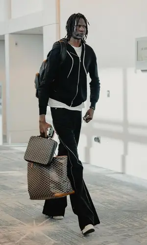 Bol Bol wearing Goyard bag