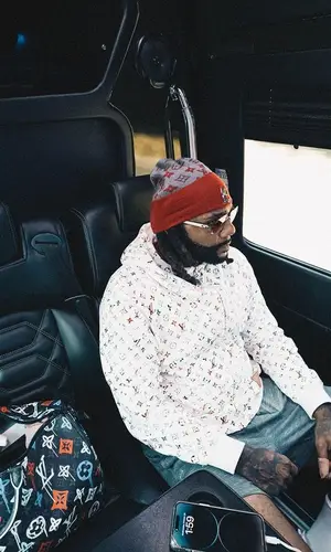 Money Man’s Outfit in Cartier Eyewear & Louis Vuitton Hat (2023)