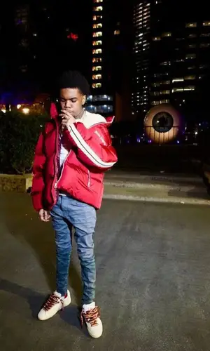 Lil Poppa’s Outfit in Palm Angels Jacket, Purple Brand Jeans & Nike Sneakers (2023)