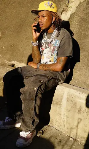 Rich The Kid wearing New Era cap