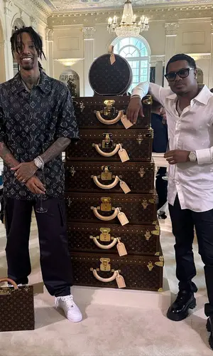 Sonny Digital wearing Louis Vuitton bag