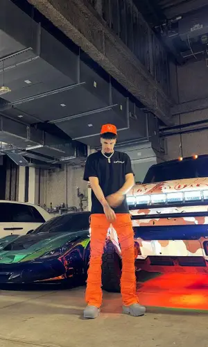 LaMelo Ball’s Outfit in LaFrance T-Shirt, Valabasas Jeans & Louis Vuitton Sandals (2023)