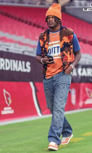 Lamar Jackson wearing Louis Vuitton jeans