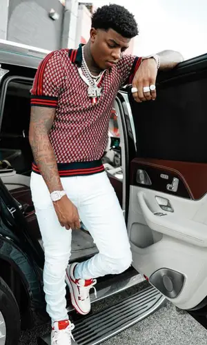 Yungeen Ace wearing Balmain shirt