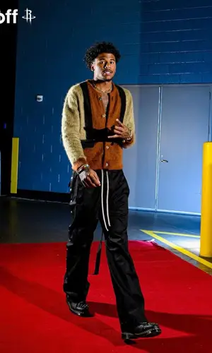 Jalen Green’s Outfit in Celine Sweater, Rick Owens Pants & Dr. Martens Boots (2023)