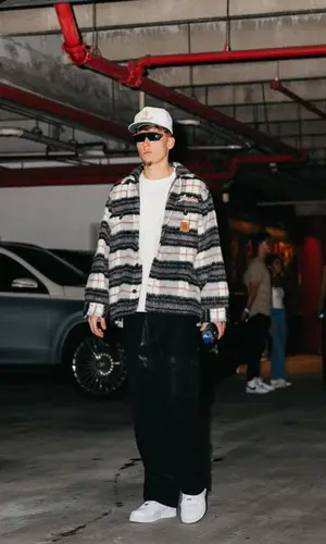 Tyler Herro’s Outfit in Sinclair Jacket, Nike Eyewear & Rhude Cap (2023)