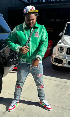 Tee Grizzley wearing New Era cap