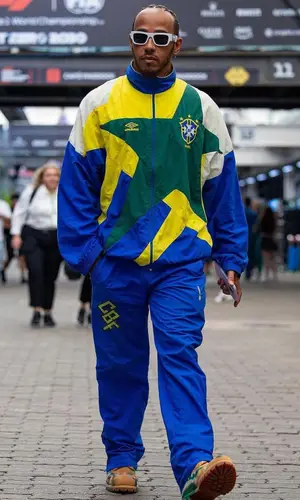 Lewis Hamilton’s Outfit in Umbro Suit, Timberland Boots & Versace Eyewear (2023)
