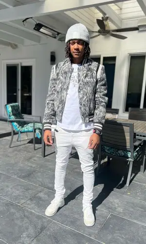 Skilla Baby wearing Amiri jacket