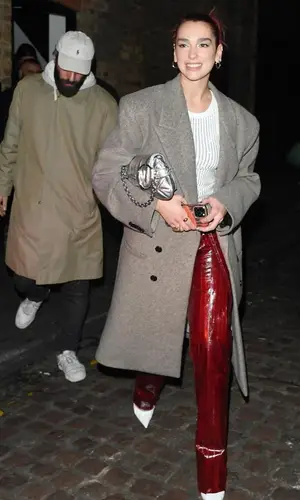 Dua Lipa’s Outfit in GCDS Jacket, The Attico Top & Gucci Bag (2023)