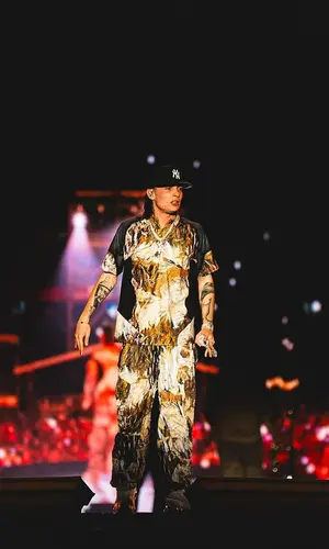Peso Pluma’s Outfit in Nocta Top, New Era Cap & Nike (2023)