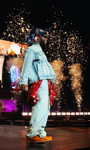Burna Boy wearing Balenciaga jeans