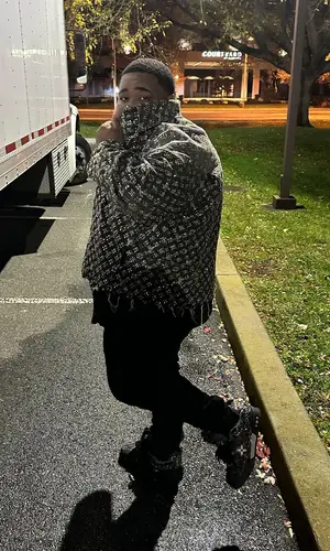 Rod Wave wearing Louis Vuitton jacket