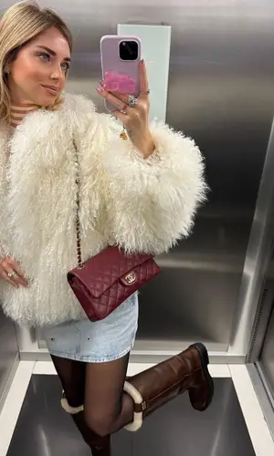 Chiara Ferragni’s Outfit in The Attico Jacket, Calvin Klein Top & Miu Miu Boots (2023)