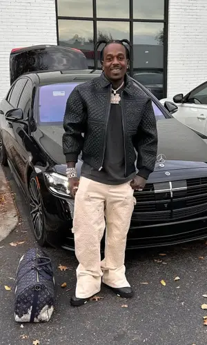 Sauce Walka wearing Louis Vuitton bag