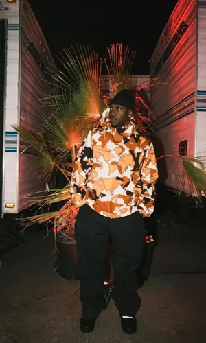 Pusha T’s Outfit in Louis Vuitton Jacket & Bottega Veneta Pants (2023)