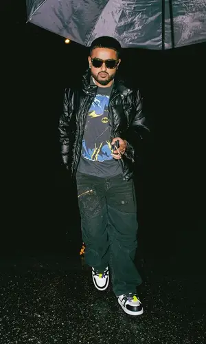 Nav’s Outfit in DC T-Shirt, Louis Vuitton Jeans & Chrome Hearts Eyewear (2023)