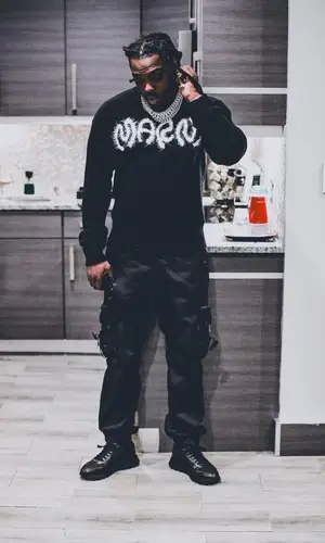 Young Scooter wearing Prada pants