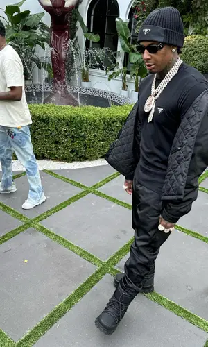 Moneybagg Yo wearing Prada pants