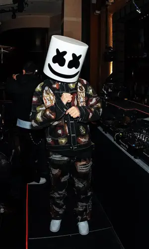 Marshmello’s Outfit in Who Decides War Jacket, Nike Sneakers & Marshmello Merch (2023)