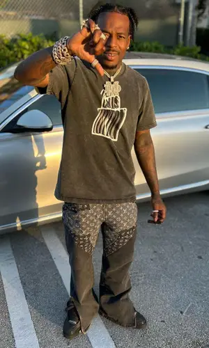 Sauce Walka wearing Louis Vuitton jeans