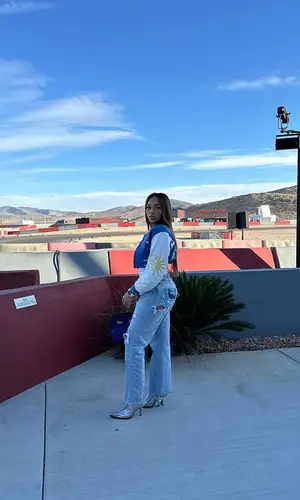 Jordyn Woods’ Outfit in Givenchy Jacket, IWC Schaffhausen Watch & Hermes Bag (2023)