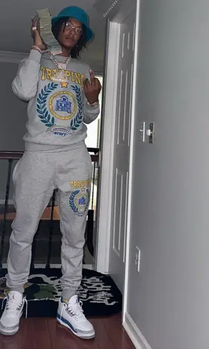 Skilla Baby wearing Kangol hat