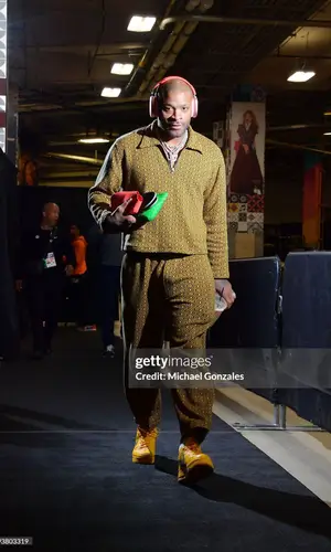 PJ Tucker’s Outfit in Bode Sweater, Bottega Veneta Bag & Apple (2023)