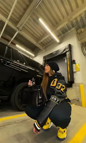 Jordyn Woods’ Outfit in Fear of God Hoodie, Jordan Sneakers & Hermes Bag (2023)