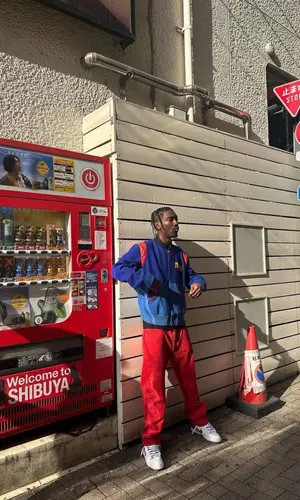 Bruce Ray wearing Kanye West Merch jacket