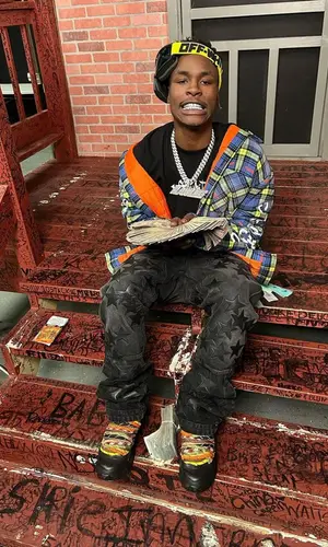 Mudbaby Ru wearing Burberry sneakers
