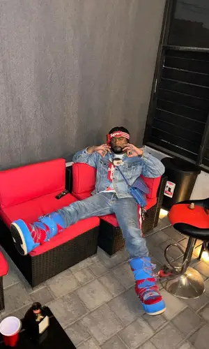 03 Greedo wearing Alanui boots