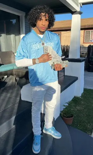 Jay Cinco’s Outfit in Chrome Hearts Jersey, Purple Brand Jeans & Bape Sneakers (2023)