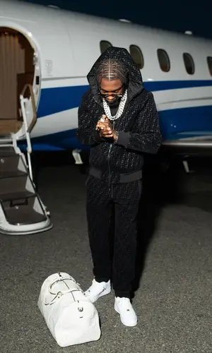 Lil Tjay wearing Fendi pants