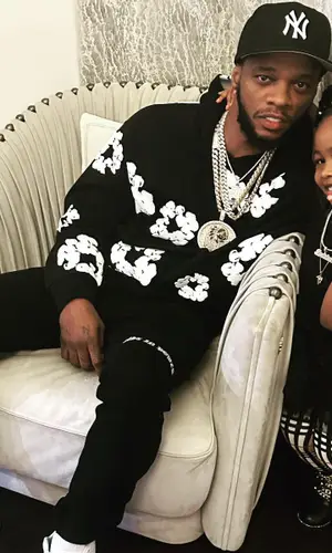 Papoose wearing New Era cap