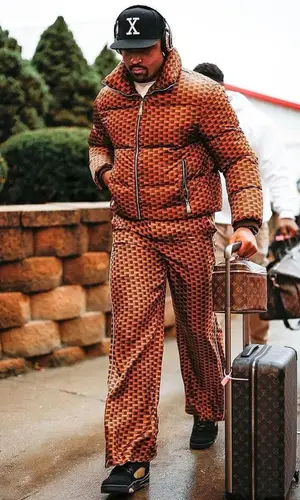 Jalen Hurts wearing Louis Vuitton bag