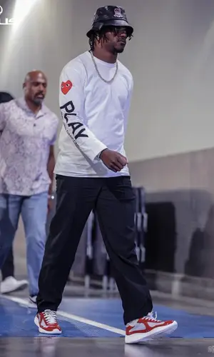 Lamar Jackson wearing Comme Des Garcons t-shirt