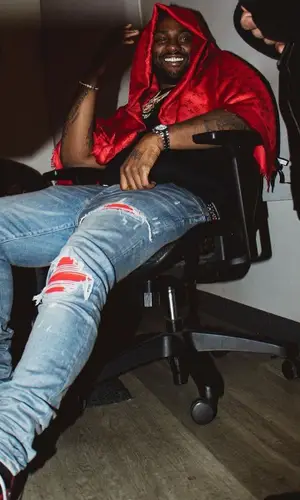 Peezy wearing Louis Vuitton scarf