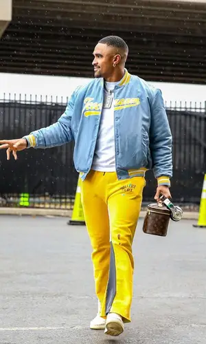 Jalen Hurts wearing Louis Vuitton bag